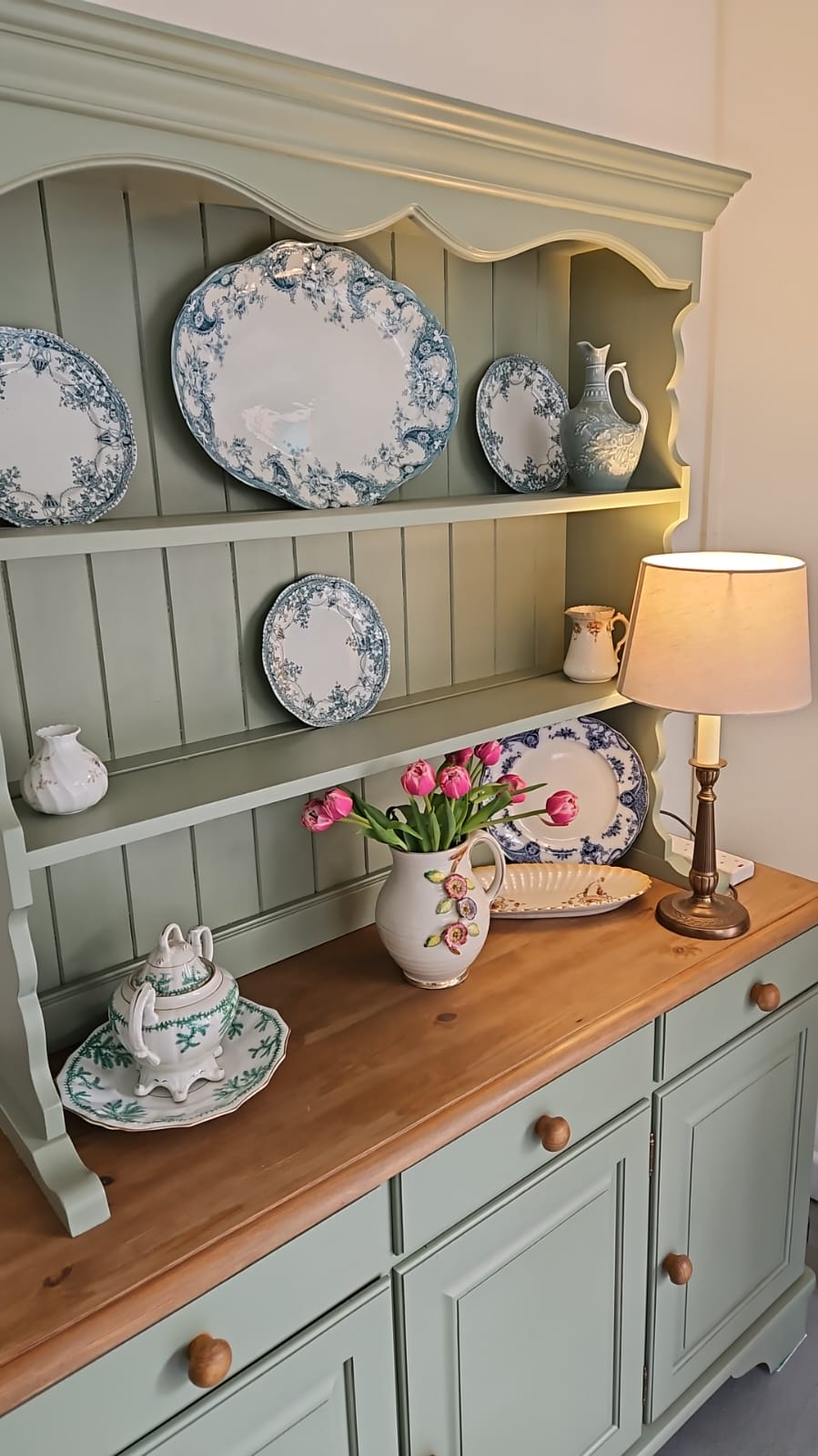 Sage painted Welsh dresser styled with vintage china